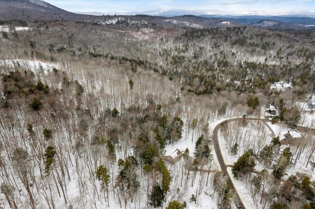 aerial view with a mountain view and a view of trees