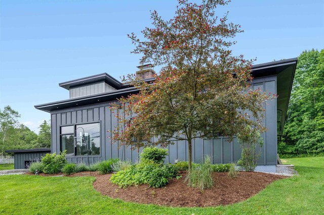 view of home's exterior with a yard