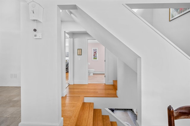 interior space with light hardwood / wood-style flooring and baseboard heating