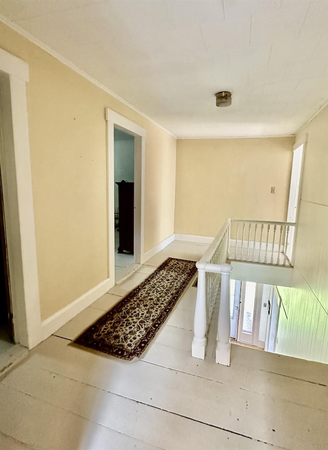 hallway featuring crown molding