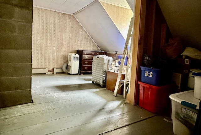 bonus room featuring hardwood / wood-style flooring, vaulted ceiling, and a baseboard heating unit