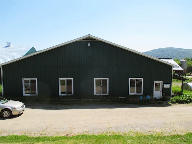 view of home's exterior with a mountain view