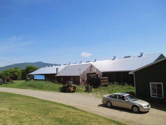 view of property exterior featuring a mountain view