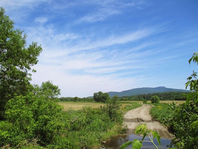 property view of mountains featuring a rural view