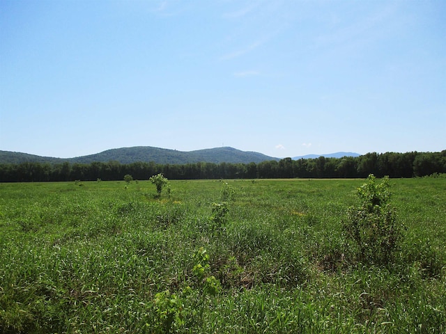 view of mountain feature with a rural view