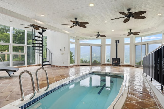 view of pool featuring a wood stove