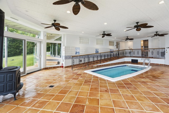 view of pool with an indoor hot tub