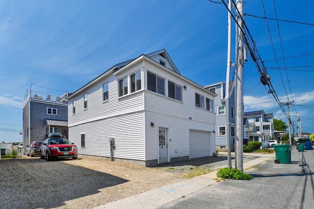 view of property exterior featuring a garage