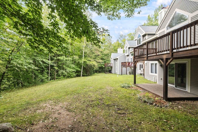 view of yard with a wooden deck