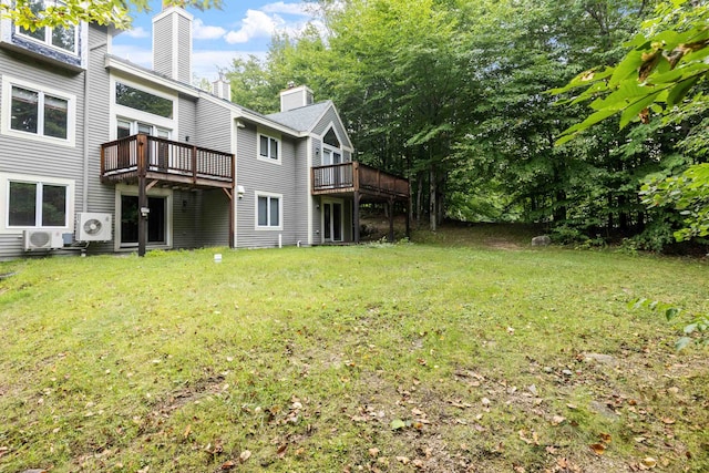 view of yard featuring a wooden deck and ac unit