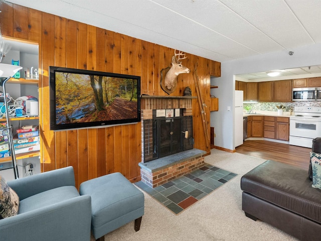 carpeted living room featuring a fireplace