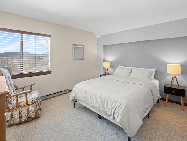 bedroom with baseboard heating and carpet flooring