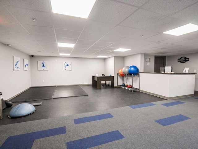 workout room with a drop ceiling