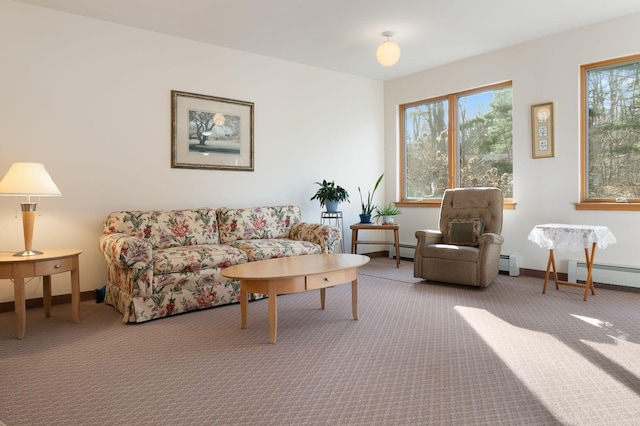 living room with baseboard heating and carpet flooring