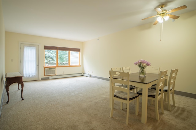 carpeted dining space with an AC wall unit, a baseboard radiator, and ceiling fan