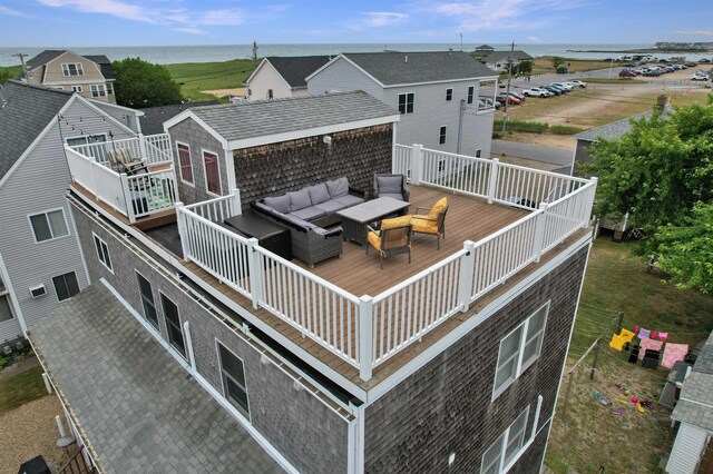 rear view of property with an outdoor hangout area and a wooden deck