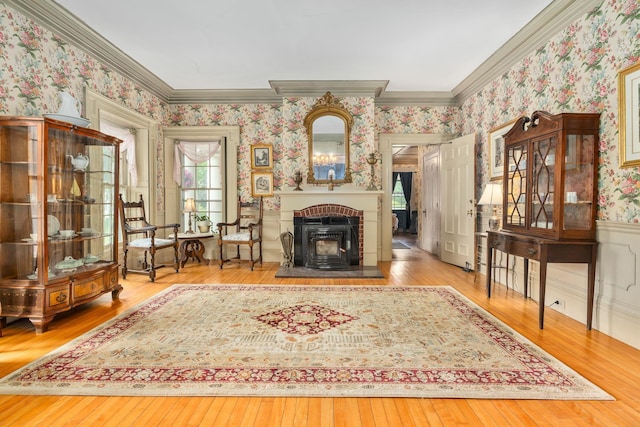 unfurnished room featuring crown molding, wood-type flooring, and a healthy amount of sunlight