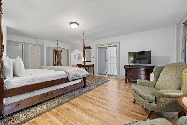 bedroom featuring access to outside and light wood-type flooring