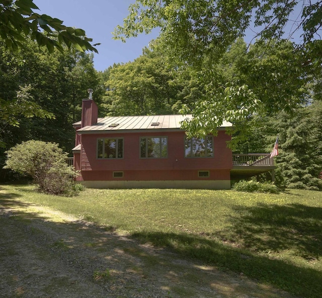 view of home's exterior with a lawn