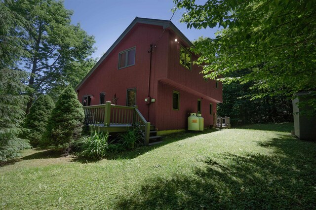 view of side of home featuring a yard