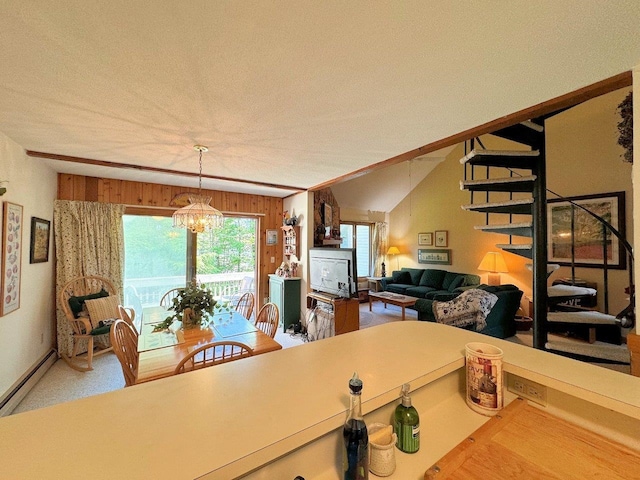 34 Sugar Brook Rd Unit F4, Peru, VT 05152 - dining area featuring a chandelier, a baseboard radiator, and vaulted ceiling