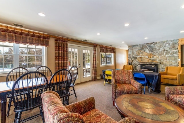 34 Sugar Brook Rd Unit F4, Peru, VT 05152 - living area with carpet flooring, recessed lighting, french doors, baseboards, and a stone fireplace