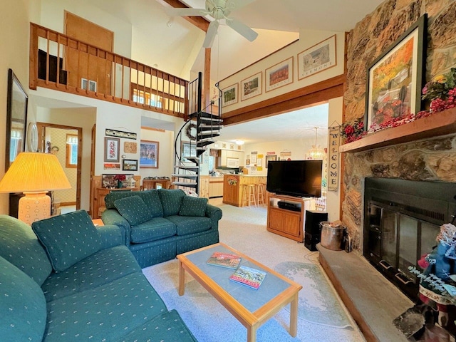 34 Sugar Brook Rd Unit F4, Peru, VT 05152 - carpeted living room with a stone fireplace, high vaulted ceiling, stairway, and ceiling fan