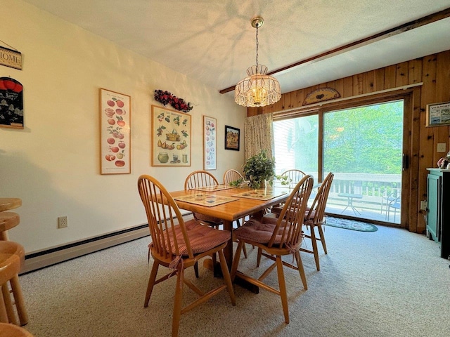 34 Sugar Brook Rd Unit F4, Peru, VT 05152 - dining area featuring light colored carpet, a chandelier, wooden walls, and baseboard heating