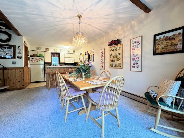 34 Sugar Brook Rd Unit F4, Peru, VT 05152 - dining space featuring a chandelier, a wainscoted wall, and light carpet