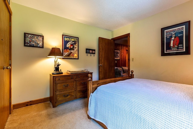 carpeted bedroom with a textured ceiling