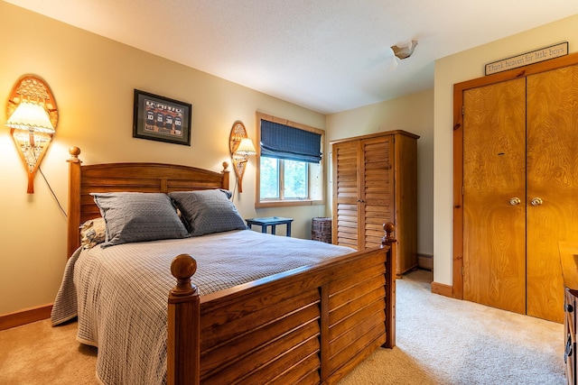 bedroom featuring light colored carpet