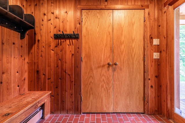 interior space featuring wood walls