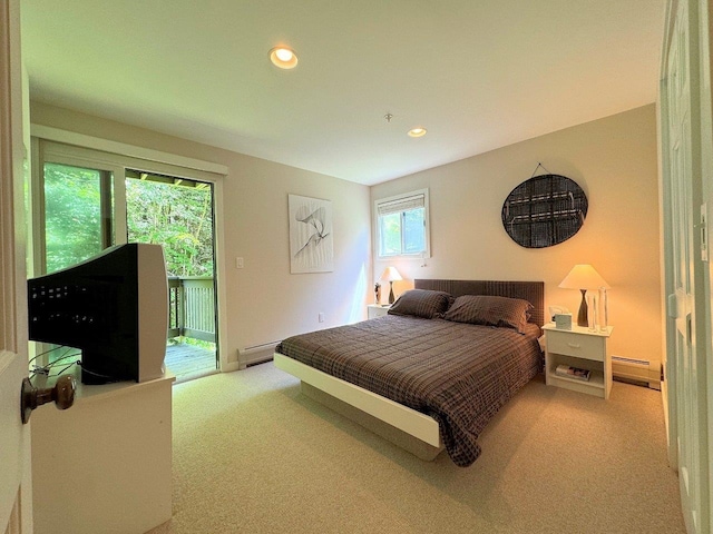 bedroom featuring multiple windows, a baseboard radiator, light colored carpet, and access to exterior