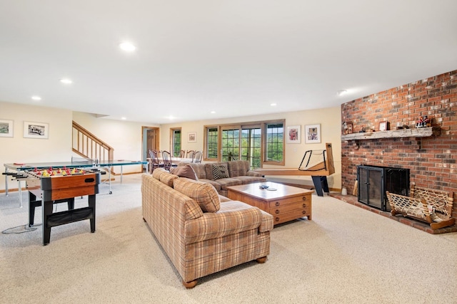 carpeted living room with a brick fireplace