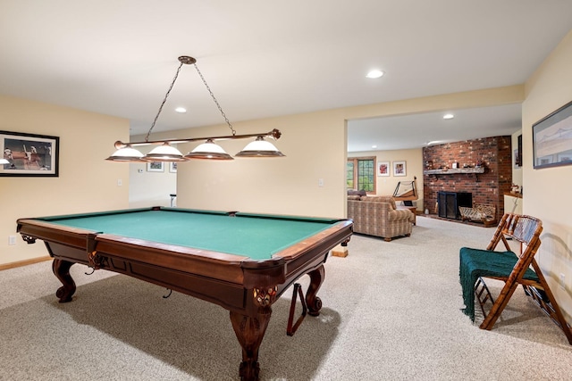 recreation room featuring a fireplace, light colored carpet, and pool table