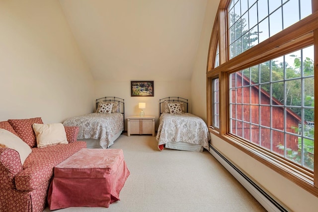 bedroom featuring baseboard heating, carpet, and lofted ceiling