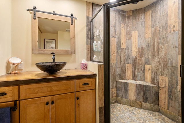 bathroom with vanity and an enclosed shower