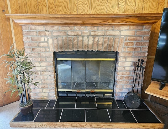 details featuring a brick fireplace