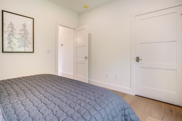 unfurnished bedroom with light wood-type flooring