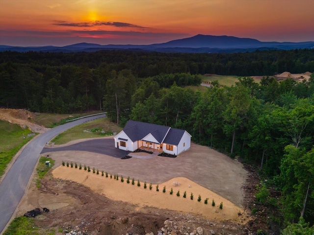 aerial view at dusk with a mountain view