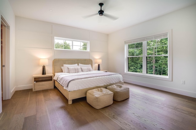 bedroom featuring ceiling fan and wood-type flooring