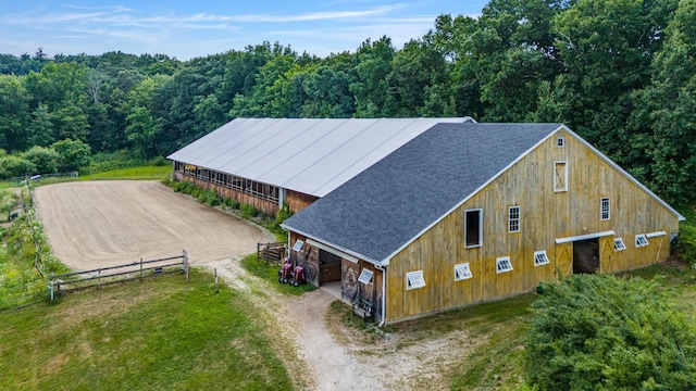 drone / aerial view featuring a forest view