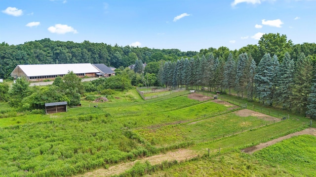 bird's eye view featuring a rural view and a wooded view