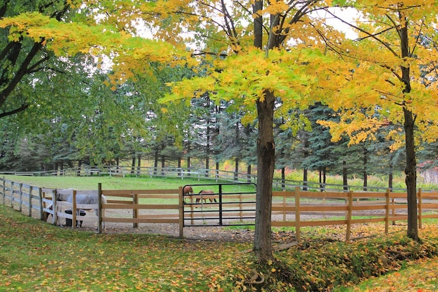 view of property's community with an enclosed area and fence