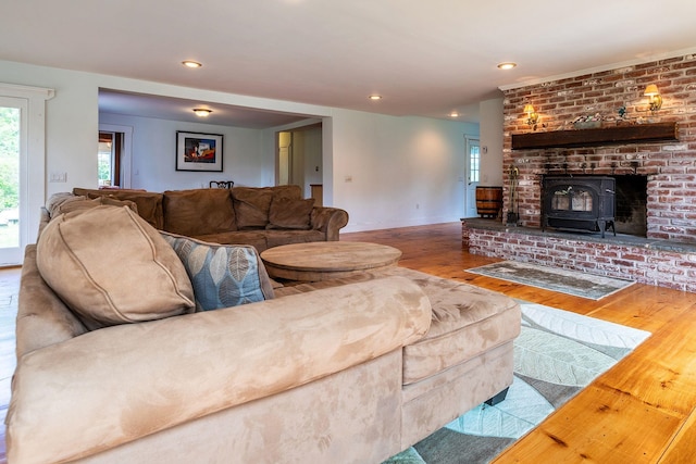 living room featuring hardwood / wood-style floors and a wood stove