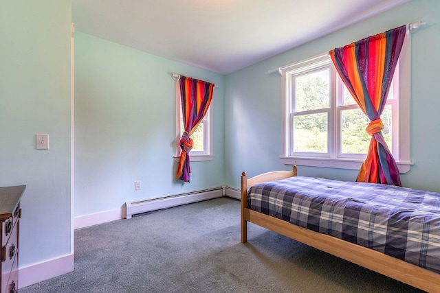 carpeted bedroom with baseboard heating