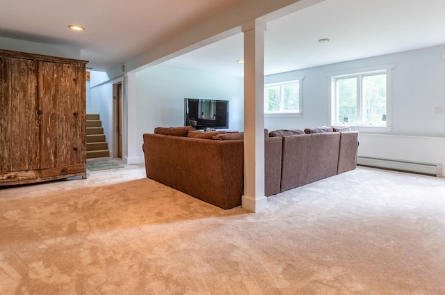 carpeted living room with baseboard heating