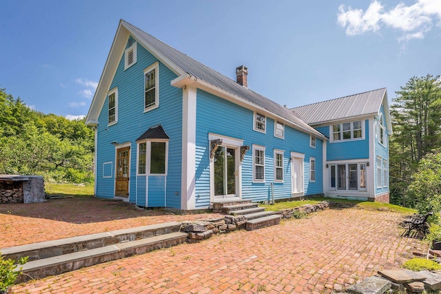 rear view of property with a patio