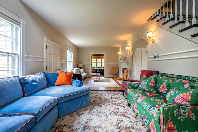 living room with hardwood / wood-style flooring and a healthy amount of sunlight