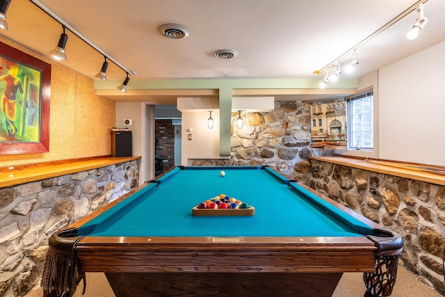 game room with rail lighting